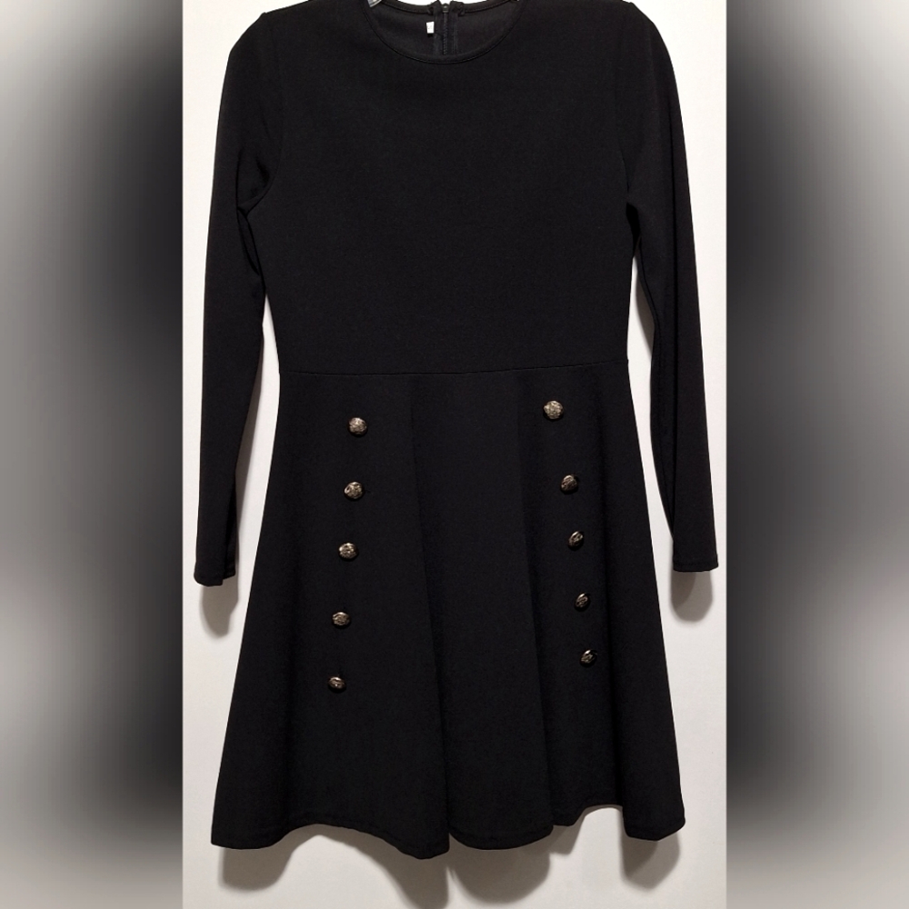 CHIC BLACK A-LINE DRESS WITH SILVER BUTTON ACCENTS AND LONG SLEEVES.